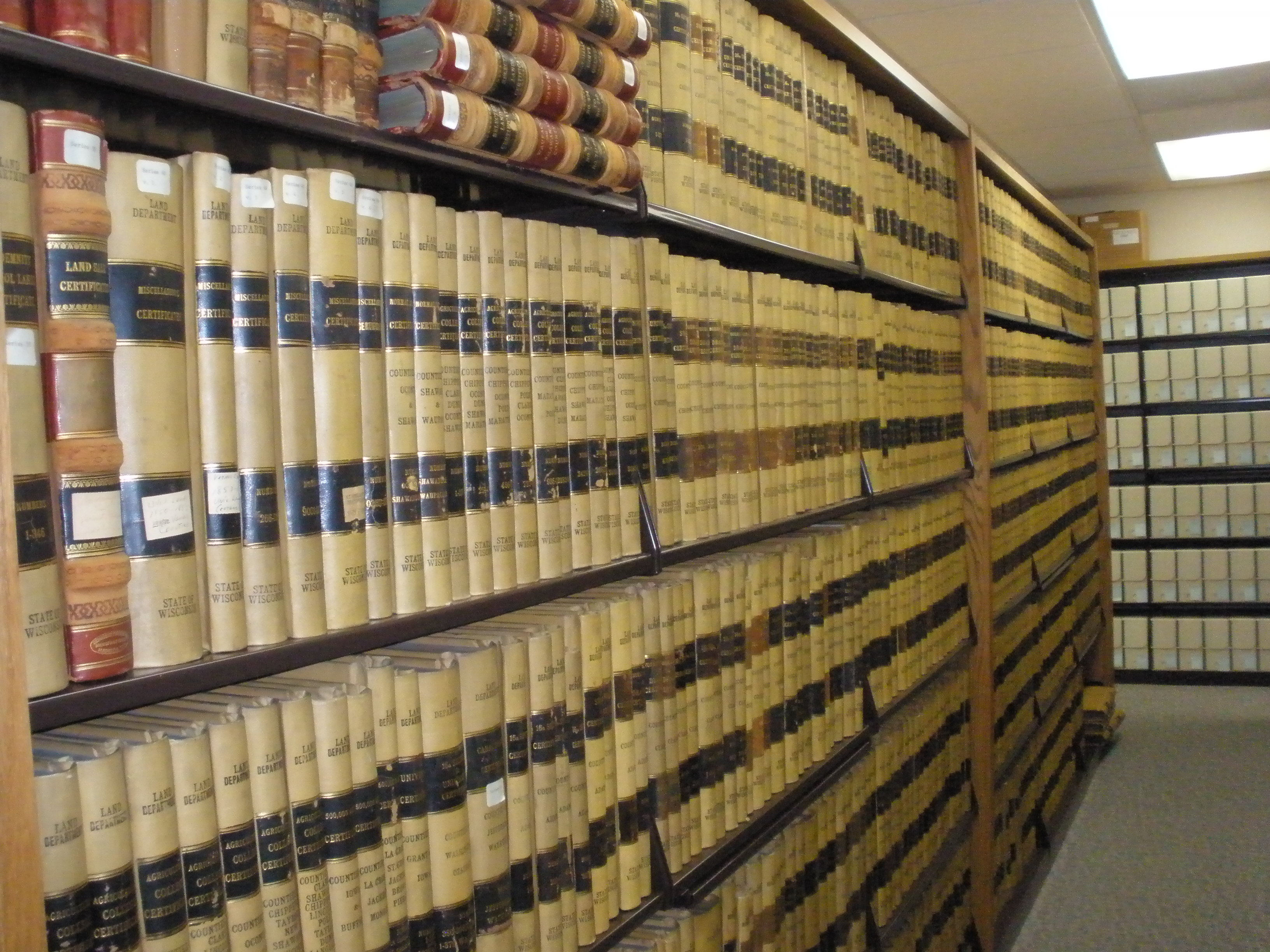 Bookshelves in the archive spanning amost floor to ceiling