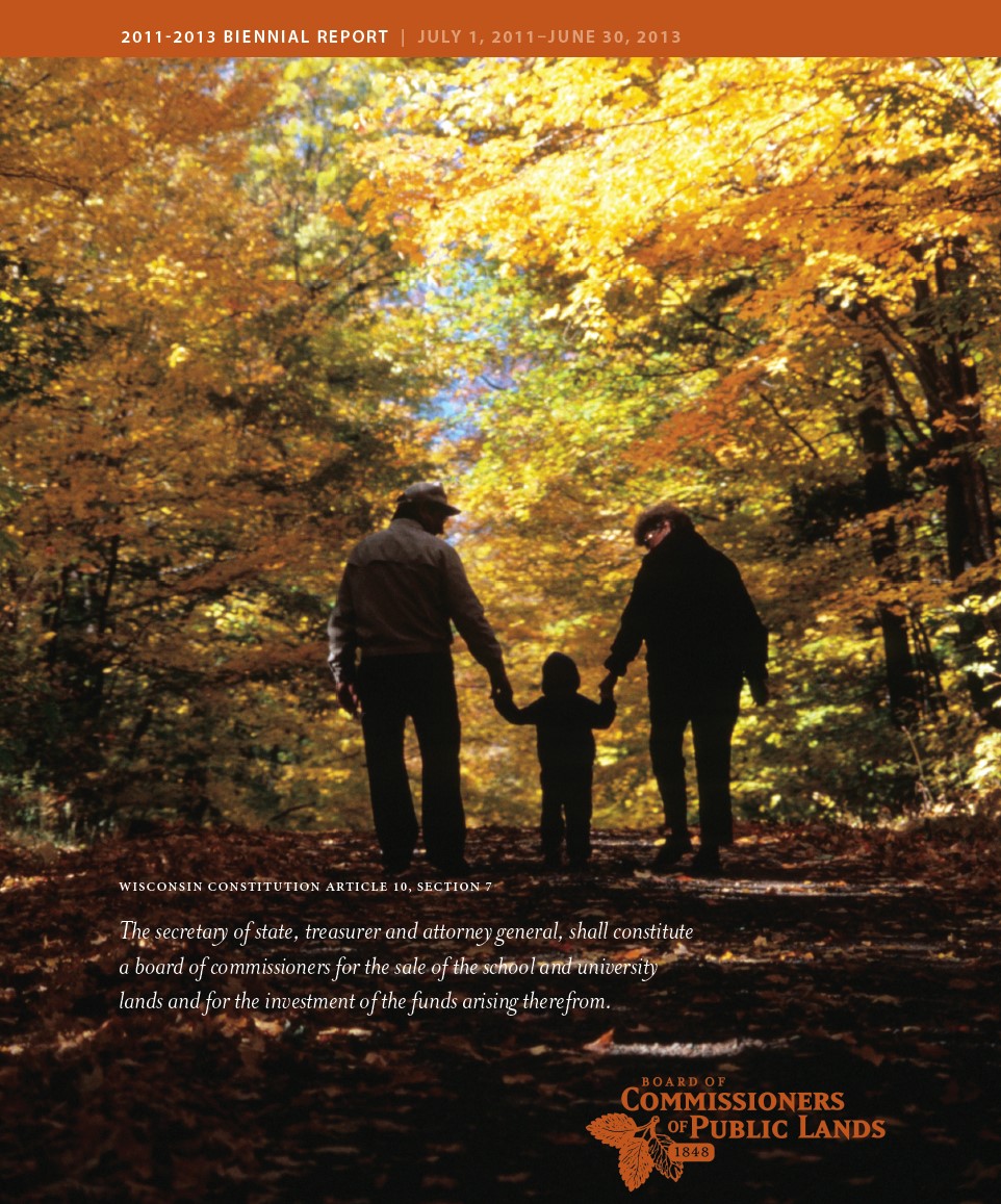 2011-2013 biennialk report cover  shwoing a couple holding hands of a child strolling down a leaf covered path  in fall