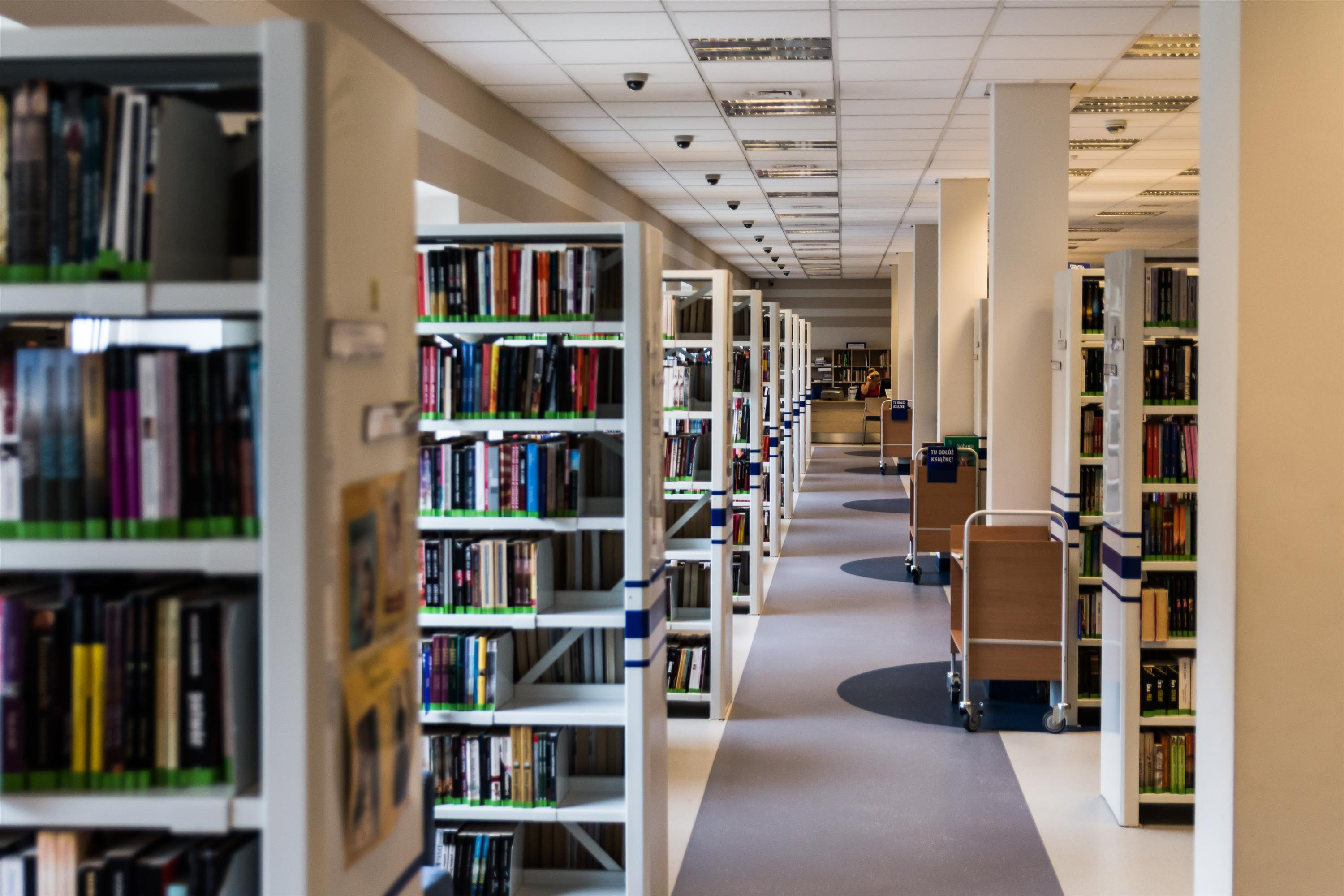 Rack of library books on left and right