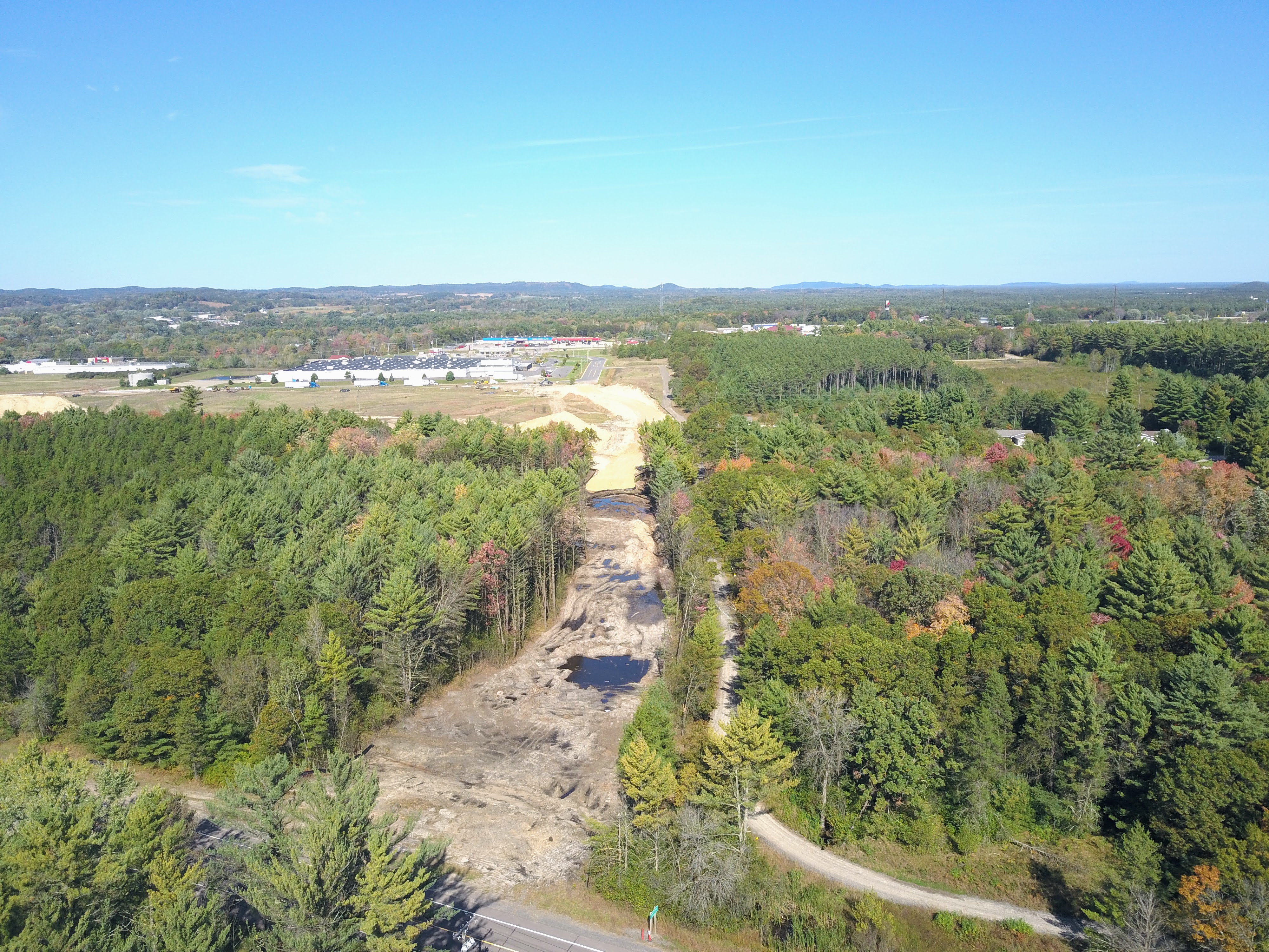 Aerial photo of the City of Black River Falls business park development area after tree cutting, Earth moving work has started f