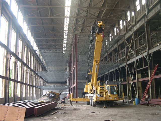 Interior construction photo with large crane building the 4 story Summit Place business center in the City of West Allis