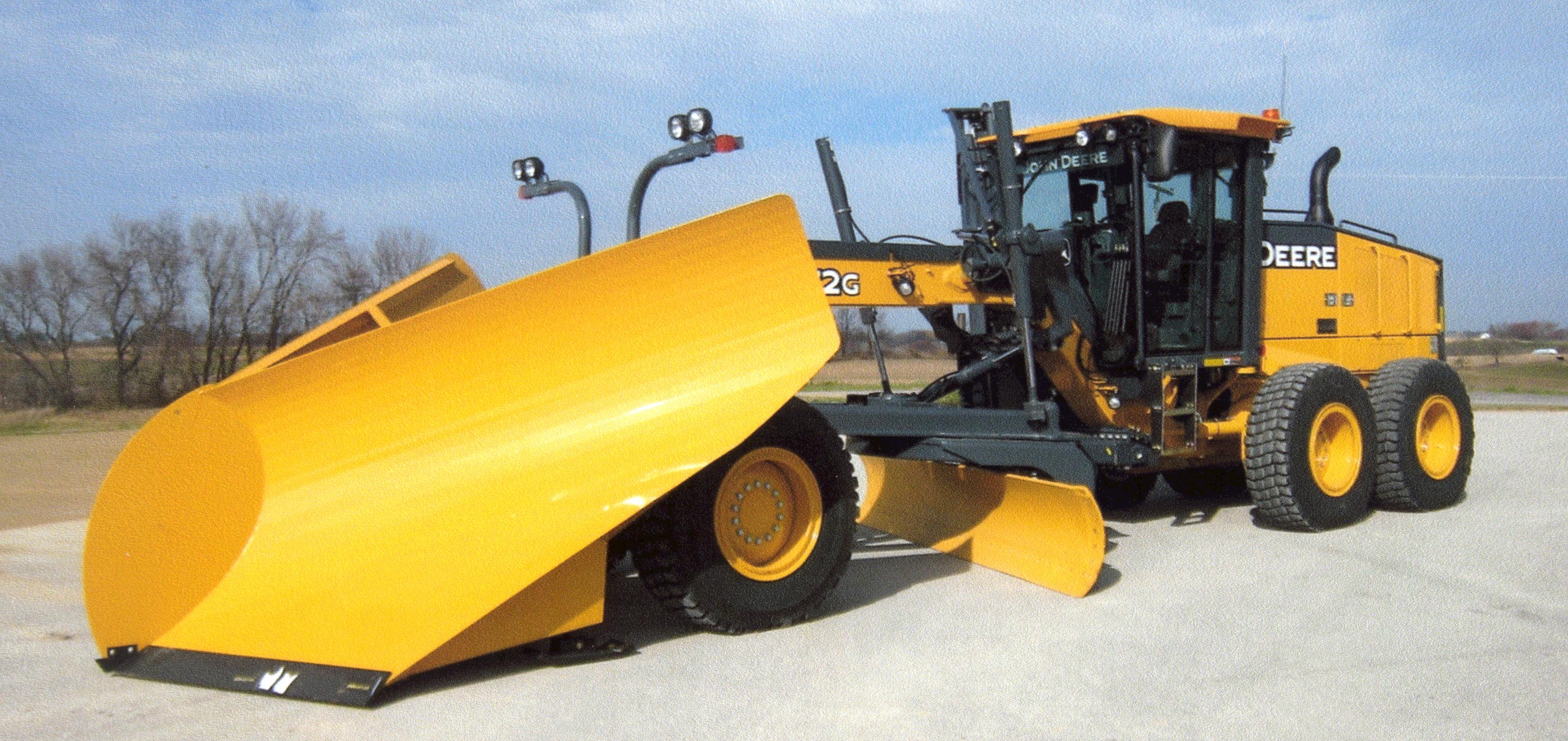 Front profile of a large yellow John Deere road grader in the Town of Christiania